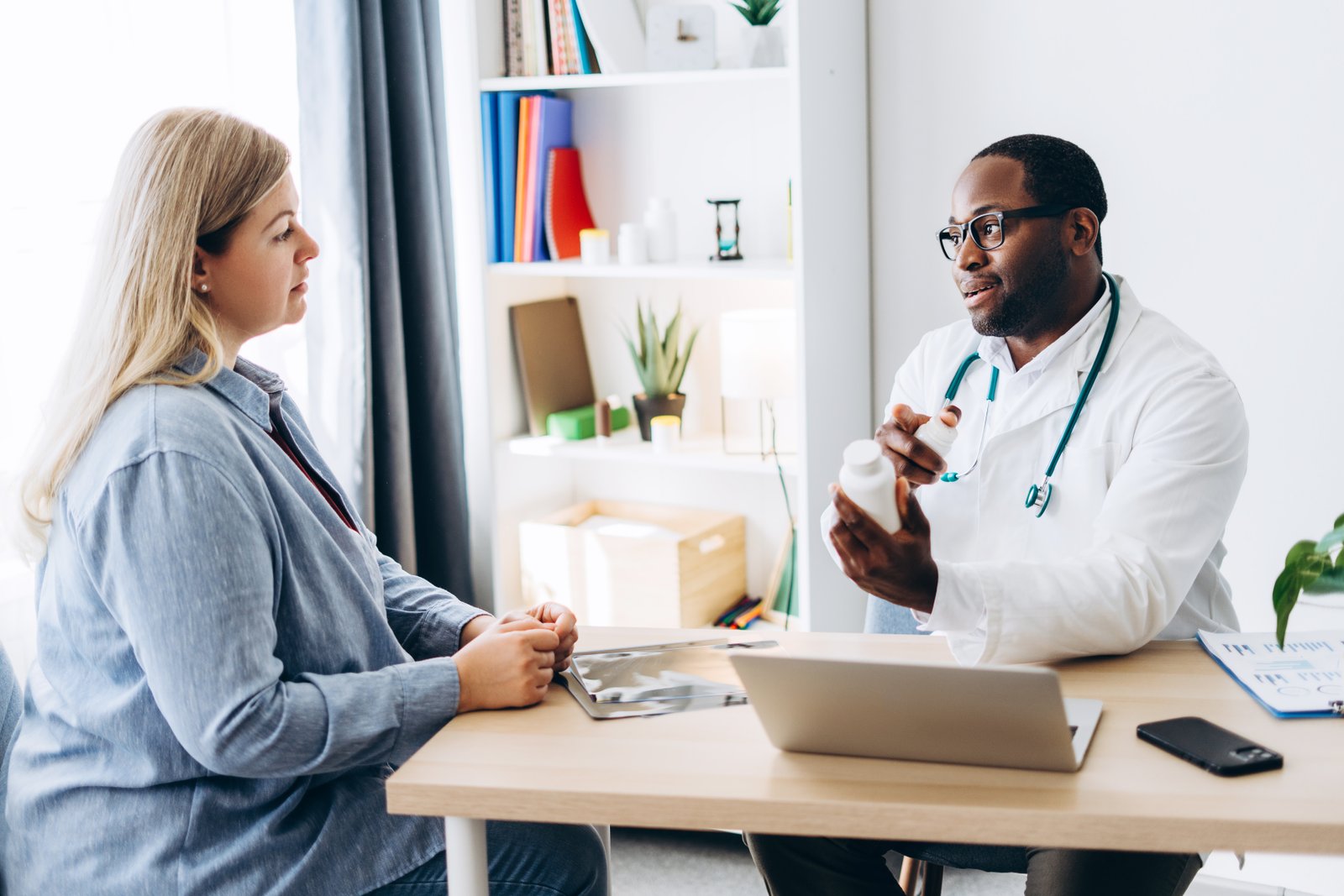 Doctor consulting with patient